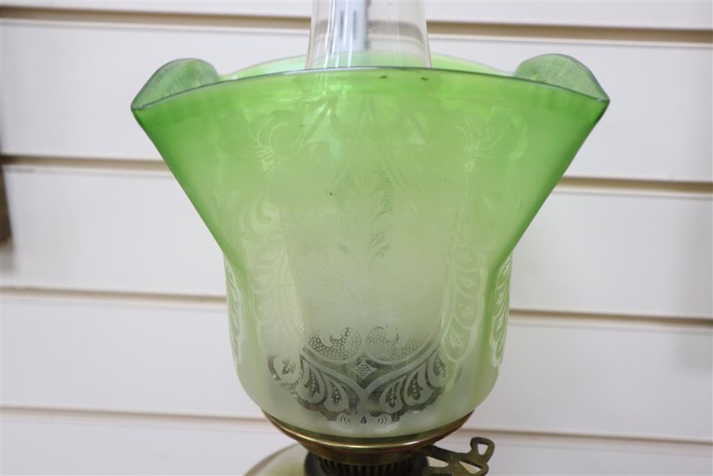An Edwardian brass and glass oil lamp